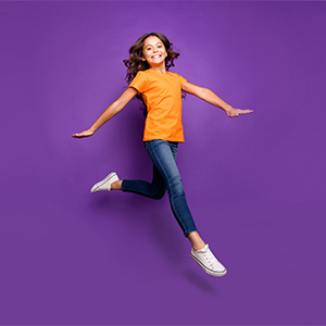 girl jumping on purple photography background girl jumping on purple photography background